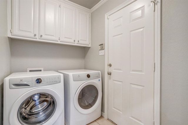 2900 Miles Way, Bedford, TX 76021 - laundry area with independent washer and dryer, cabinet space, crown molding, and light tile patterned floors