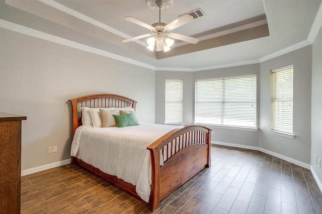 2900 Miles Way, Bedford, TX 76021 - bedroom with a tray ceiling, wood finished floors, baseboards, ornamental molding, and ceiling fan
