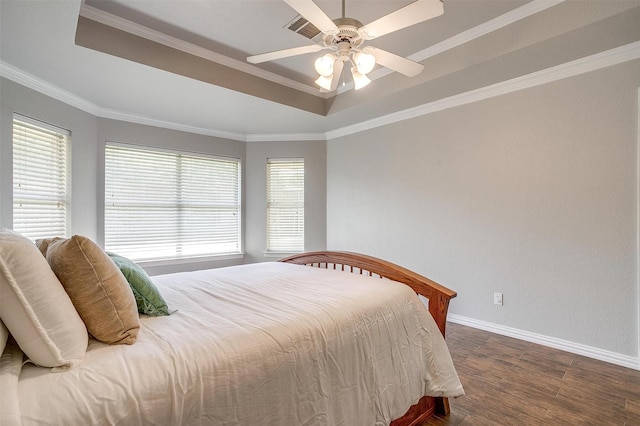 2900 Miles Way, Bedford, TX 76021 - bedroom with a raised ceiling, wood finished floors, baseboards, crown molding, and a ceiling fan
