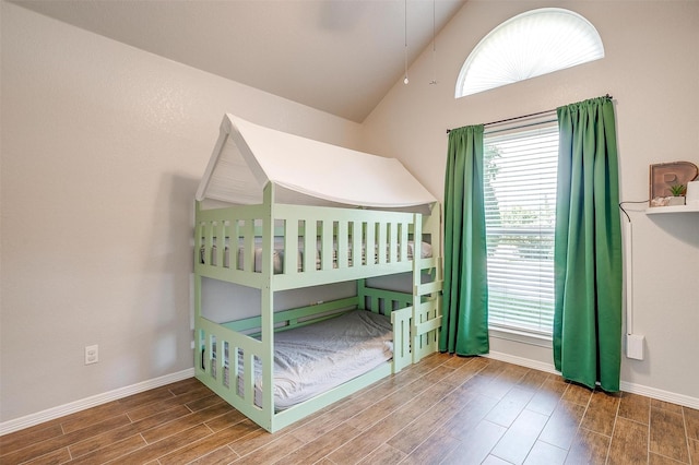 2900 Miles Way, Bedford, TX 76021 - bedroom with wood finished floors, lofted ceiling, multiple windows, and baseboards