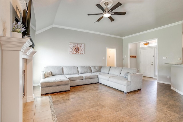 2900 Miles Way, Bedford, TX 76021 - living area featuring a ceiling fan, a fireplace, baseboards, ornamental molding, and light wood-type flooring