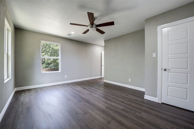 12111 Galva Dr, Dallas, TX 75243 - empty room with a ceiling fan, dark wood-type flooring, and baseboards
