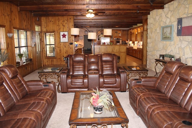801 County Road 313, Eastland, TX 76448 - living room with carpet, wood walls, wood ceiling with exposed beams, and ceiling fan