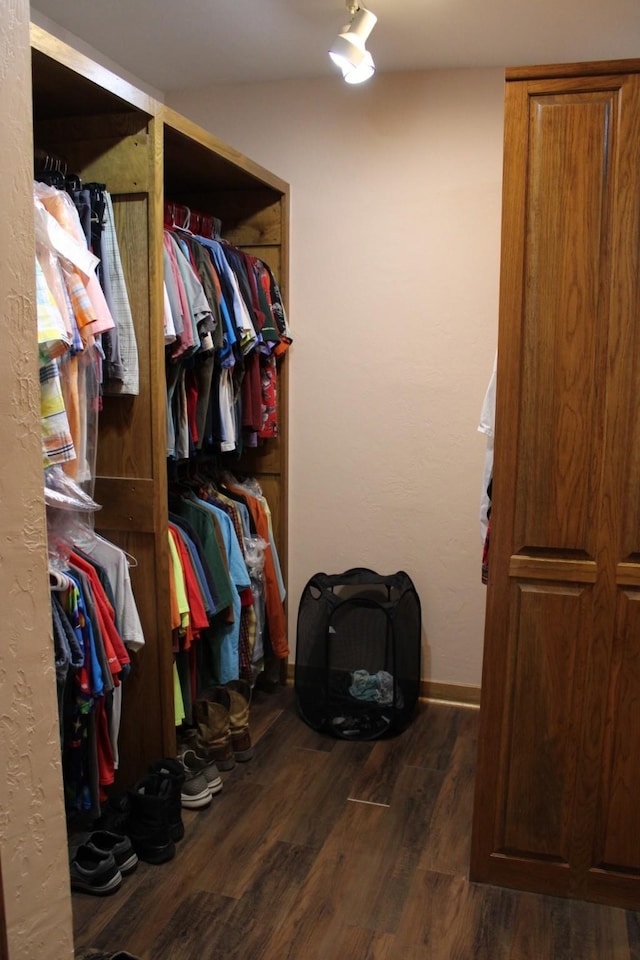 801 County Road 313, Eastland, TX 76448 - walk in closet featuring dark wood-style floors