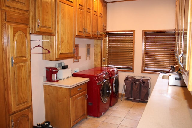 801 County Road 313, Eastland, TX 76448 - washroom with cabinet space, separate washer and dryer, and light tile patterned floors