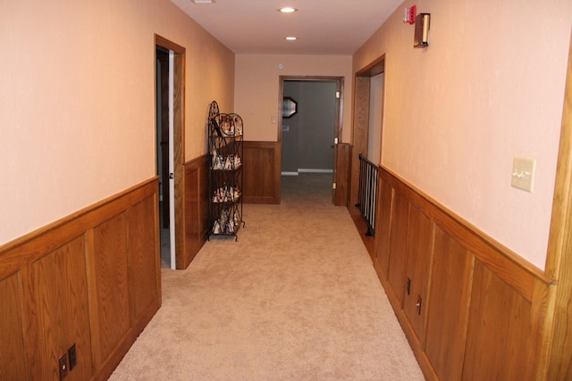 801 County Road 313, Eastland, TX 76448 - corridor featuring wainscoting, light carpet, wooden walls, and recessed lighting
