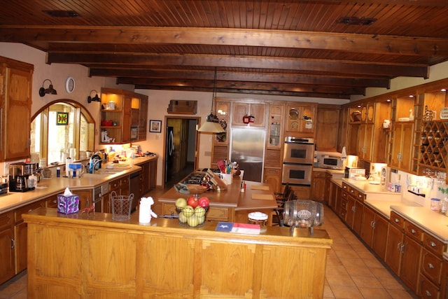 801 County Road 313, Eastland, TX 76448 - kitchen featuring appliances with stainless steel finishes, a kitchen island, open shelves, a sink, and wooden ceiling with exposed beams