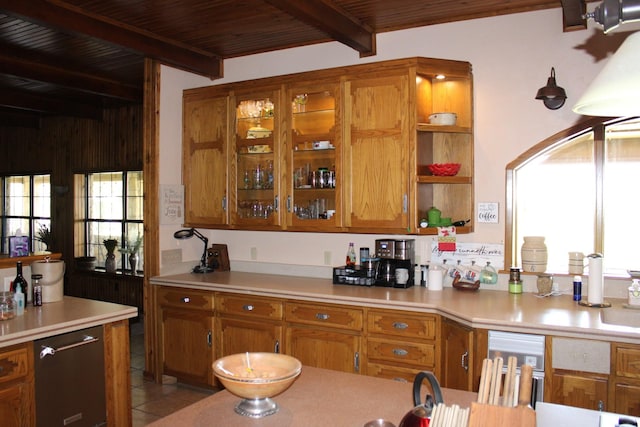 801 County Road 313, Eastland, TX 76448 - kitchen with brown cabinetry, light countertops, open shelves, and wood ceiling with exposed beams