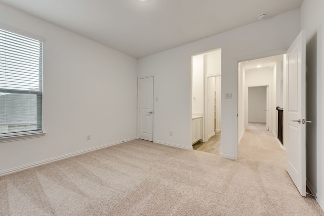801 Enys Way, Mckinney, TX 75069 - unfurnished bedroom featuring light colored carpet, attic access, multiple windows, and baseboards