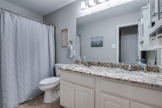 1350 Amistad Dr, Prosper, TX 75078 - full bath with toilet, double vanity, tile patterned flooring, and curtained shower