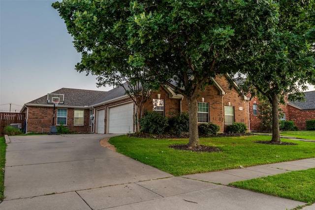 1350 Amistad Dr, Prosper, TX 75078 - view of front facade featuring brick siding, a front yard, concrete driveway, and a garage