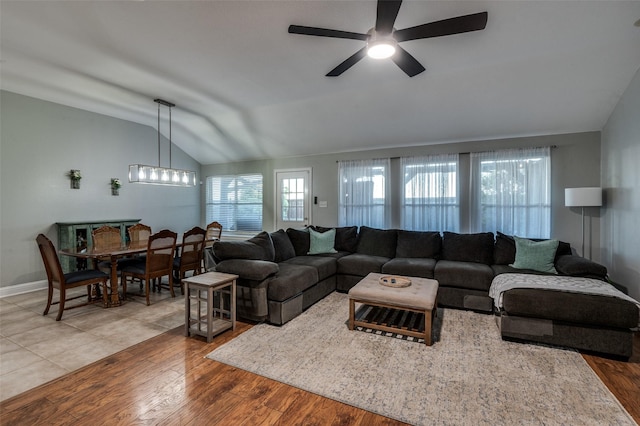 1350 Amistad Dr, Prosper, TX 75078 - living area featuring vaulted ceiling, a ceiling fan, wood finished floors, and baseboards