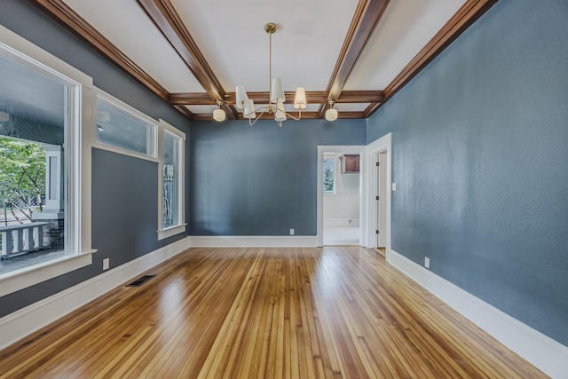 5532 Reiger Ave, Dallas, TX 75214 - empty room featuring a chandelier, hardwood / wood-style floors, coffered ceiling, baseboards, and beamed ceiling