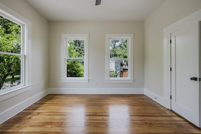 5532 Reiger Ave, Dallas, TX 75214 - unfurnished room with wood finished floors, baseboards, and a ceiling fan