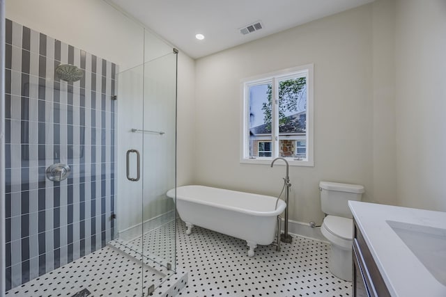 5532 Reiger Ave, Dallas, TX 75214 - full bathroom featuring a stall shower, a freestanding tub, vanity, toilet, and baseboards