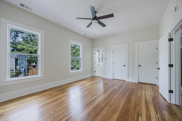5532 Reiger Ave, Dallas, TX 75214 - unfurnished bedroom with light wood-style floors, baseboards, and ceiling fan
