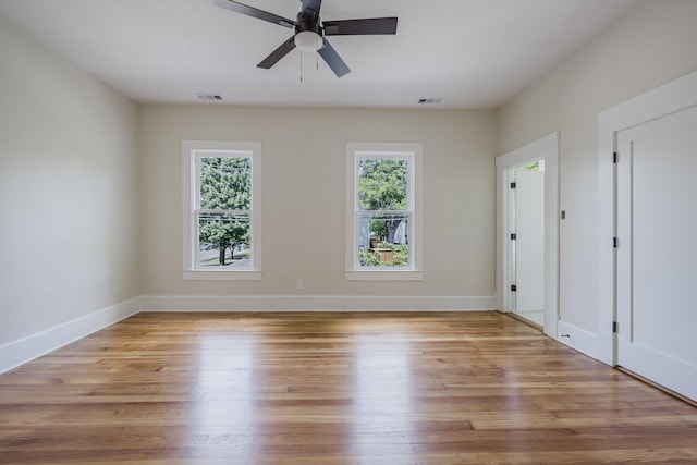 5532 Reiger Ave, Dallas, TX 75214 - spare room with a ceiling fan, light wood finished floors, and baseboards