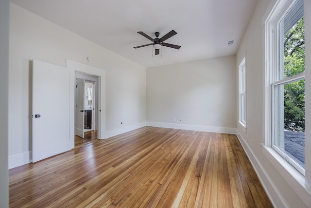 5532 Reiger Ave, Dallas, TX 75214 - spare room with light wood-style flooring, healthy amount of natural light, a ceiling fan, and baseboards
