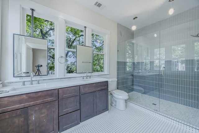 5532 Reiger Ave, Dallas, TX 75214 - full bath with a shower stall, double vanity, and toilet