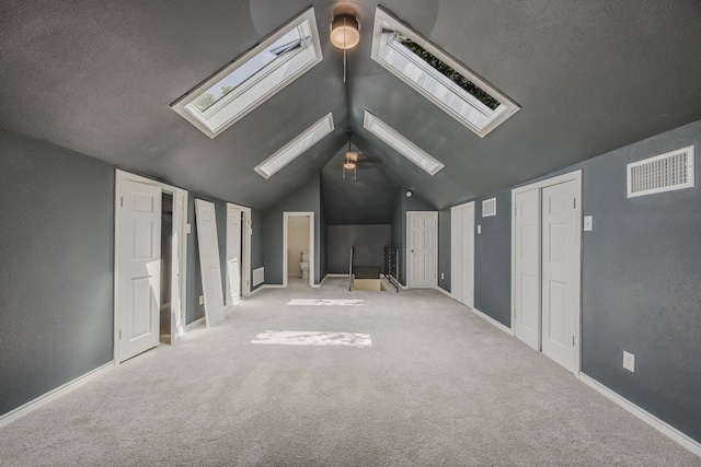 5532 Reiger Ave, Dallas, TX 75214 - additional living space with a skylight, vaulted ceiling, carpet floors, and baseboards