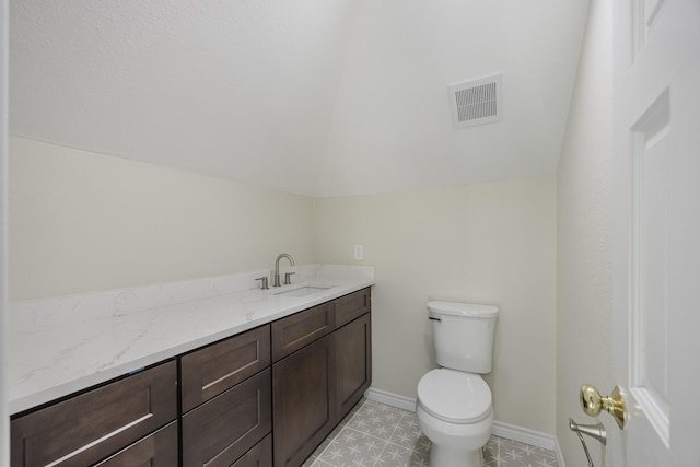 5532 Reiger Ave, Dallas, TX 75214 - half bathroom featuring toilet, vaulted ceiling, vanity, and baseboards