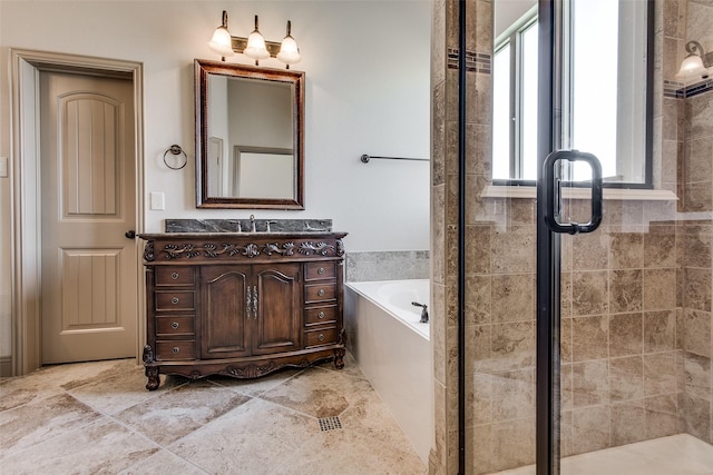 3009 Guadalupe Dr, Forney, TX 75126 - bathroom with vanity, a bath, and a stall shower