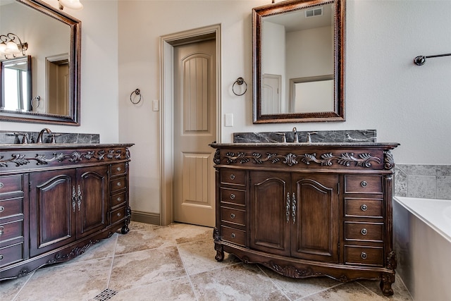3009 Guadalupe Dr, Forney, TX 75126 - full bath with two vanities and a bathtub