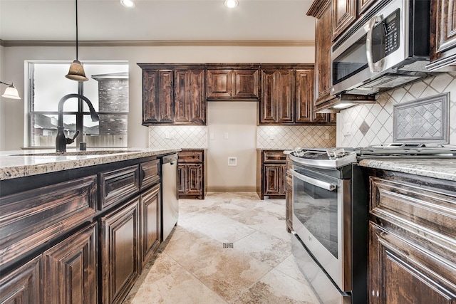 3009 Guadalupe Dr, Forney, TX 75126 - kitchen featuring stainless steel appliances, a sink, light stone counters, tasteful backsplash, and hanging light fixtures