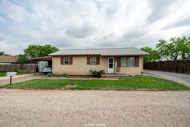 1302 6th St, Anson, TX 79501 - ranch-style home featuring driveway, metal roof, and an attached carport