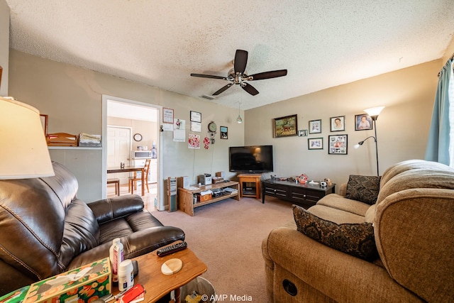 1302 6th St, Anson, TX 79501 - living room featuring ceiling fan, carpet, and a textured ceiling