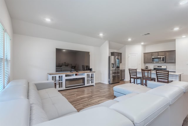 117 Sir Barton Ln, Caddo Mills, TX 75135 - living room featuring wood finished floors, recessed lighting, and baseboards