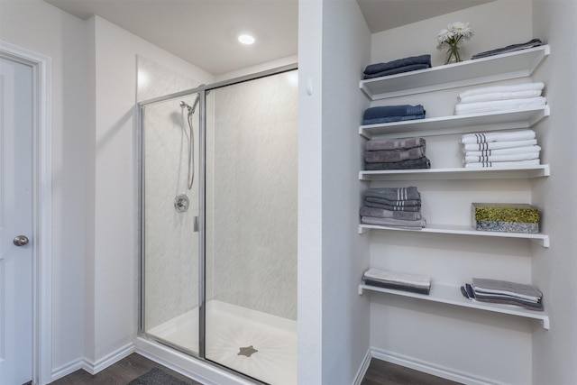 117 Sir Barton Ln, Caddo Mills, TX 75135 - bathroom with wood finished floors, a shower stall, baseboards, and recessed lighting