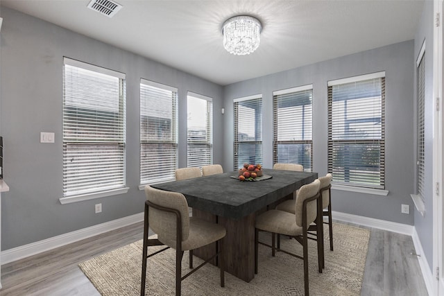716 Field Xing, Little Elm, TX 76227 - dining space featuring a chandelier, baseboards, and light wood-style floors