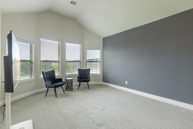716 Field Xing, Little Elm, TX 76227 - living area with lofted ceiling, carpet, and baseboards