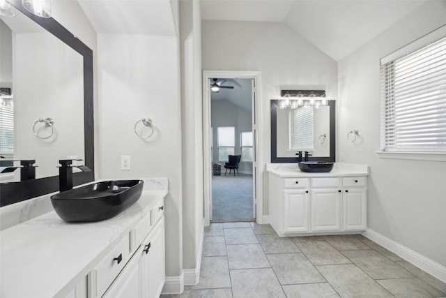 716 Field Xing, Little Elm, TX 76227 - full bath with vaulted ceiling, two vanities, a ceiling fan, baseboards, and tile patterned floors