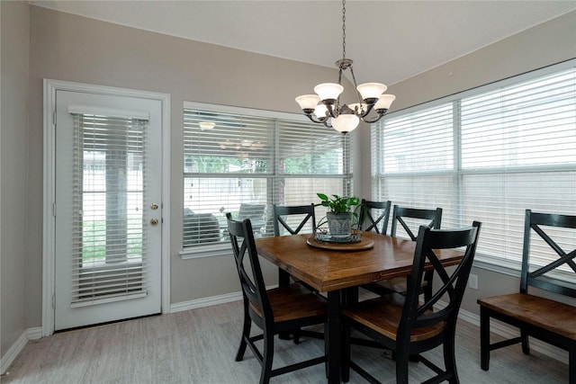 7951 Belladonna Dr, Fort Worth, TX 76123 - dining space with baseboards, light wood-type flooring, a chandelier, and vaulted ceiling