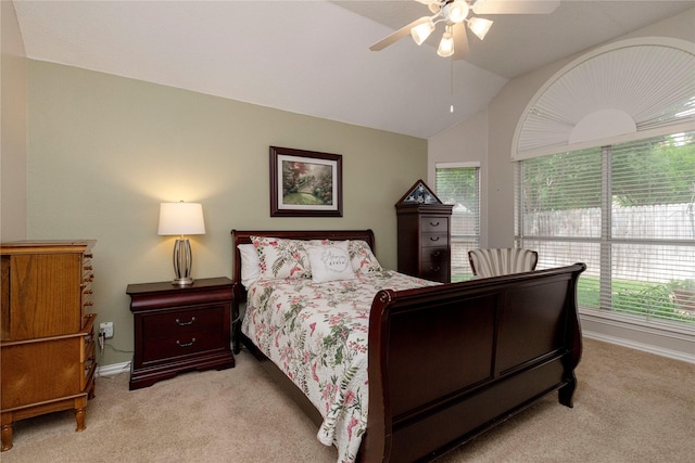7951 Belladonna Dr, Fort Worth, TX 76123 - bedroom featuring light colored carpet, multiple windows, baseboards, vaulted ceiling, and a ceiling fan