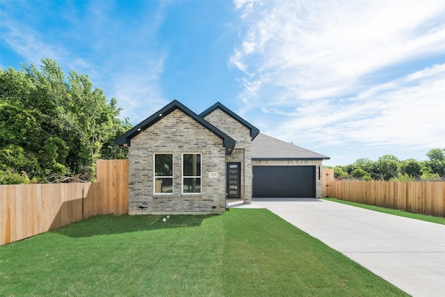 4229 Elkins Ave, Lancaster, TX 75134 - view of front of home featuring concrete driveway, a garage, and brick siding