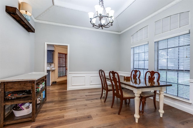 10220 Shadow Way, Dallas, TX 75243 - dining area featuring ornamental molding, plenty of natural light, wood finished floors, a chandelier, and wainscoting