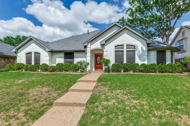 10220 Shadow Way, Dallas, TX 75243 - ranch-style house with brick siding, a front lawn, and a shingled roof