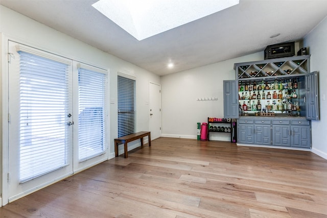 10220 Shadow Way, Dallas, TX 75243 - indoor dry bar featuring light wood-style floors, baseboards, and vaulted ceiling