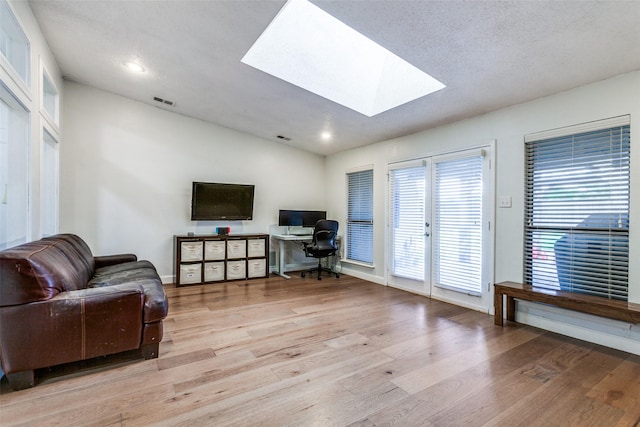 10220 Shadow Way, Dallas, TX 75243 - living area with a skylight, light wood finished floors, a desk, baseboards, and recessed lighting