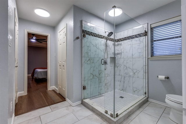 10220 Shadow Way, Dallas, TX 75243 - full bathroom featuring ensuite bathroom, a stall shower, toilet, baseboards, and ceiling fan