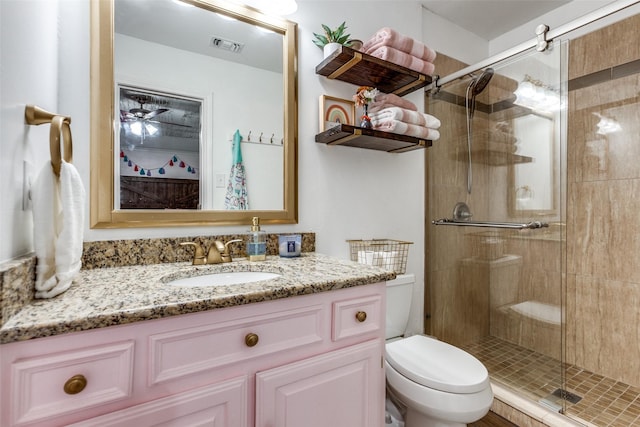 10220 Shadow Way, Dallas, TX 75243 - full bathroom with toilet, vanity, and a shower stall