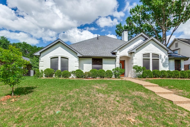 10220 Shadow Way, Dallas, TX 75243 - single story home featuring brick siding, a front yard, a chimney, and roof with shingles