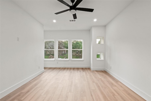 1310 Coleman Ave, Dallas, TX 75215 - unfurnished living room with light wood finished floors, baseboards, a ceiling fan, and recessed lighting