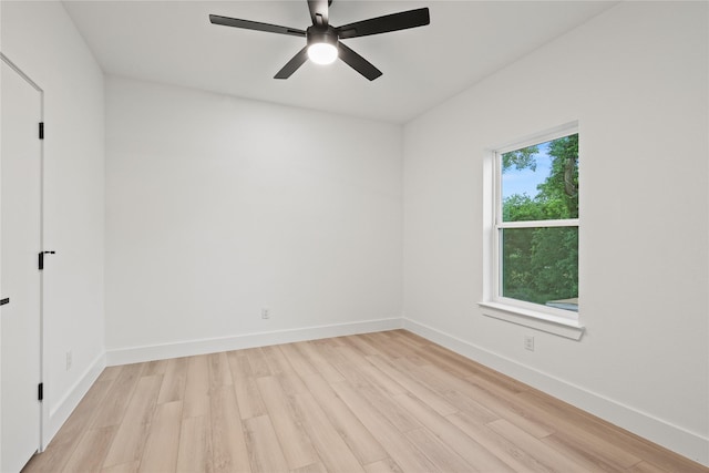 1310 Coleman Ave, Dallas, TX 75215 - spare room featuring light wood-style flooring, baseboards, and ceiling fan