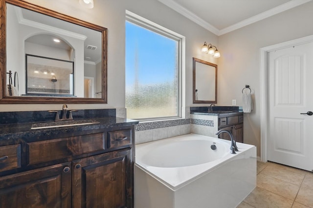 14513 Mediterranean Dr, Frisco, TX 75035 - full bathroom with crown molding, a garden tub, vanity, tile patterned flooring, and a shower