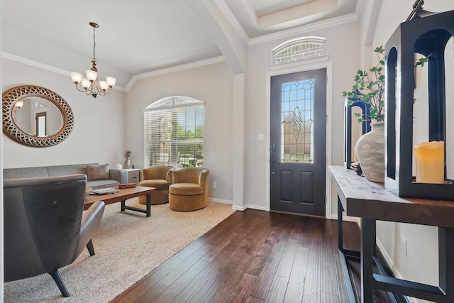 14513 Mediterranean Dr, Frisco, TX 75035 - foyer featuring dark wood-type flooring, healthy amount of natural light, a chandelier, baseboards, and ornamental molding