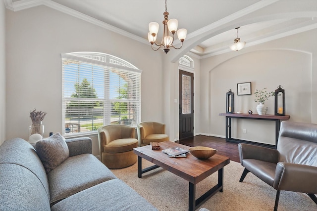 14513 Mediterranean Dr, Frisco, TX 75035 - living area with a chandelier, arched walkways, crown molding, wood finished floors, and baseboards